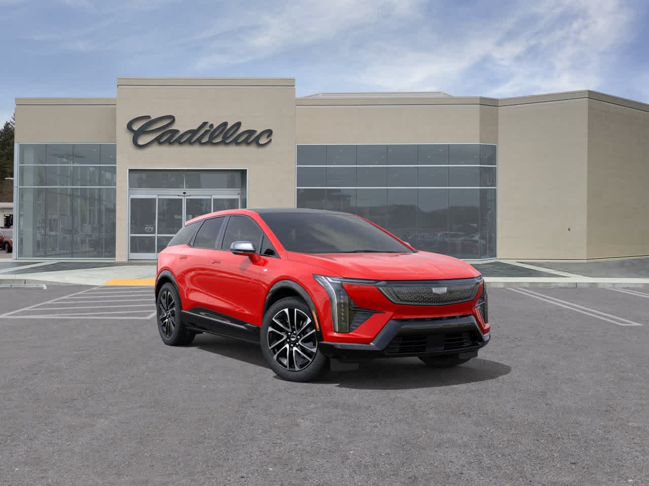 2027 Cadillac OPTIQ Sport in Monarch Orange — front three-quarter view