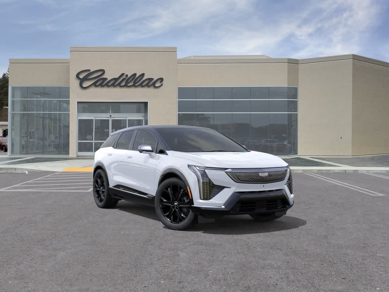 2026 Cadillac OPTIQ Premium Sport in Vibrant White Tricoat — front three-quarter view